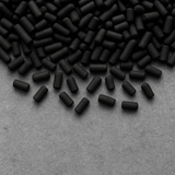 Close-up of 4 mm activated carbon pellets showing consistent pellet geometry and low dust