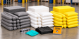 65 gallon spill kit refill with gray universal, white oil-only, and yellow Hazmat absorbents, plus gloves, goggles, disposal bags, and emergency response guidebook.