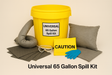 Universal 65 Gallon Spill Kit with yellow bucket, gloves, and absorbent pads on a beige background.