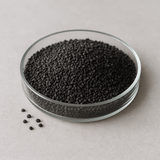 Hero: Coal-based granular activated carbon (12×40 mesh) in a glass dish on a neutral background