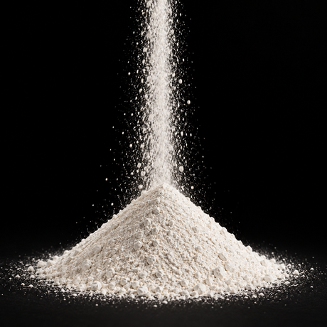 Diatomaceous earth filter aid powder cascading into a cone on a black background