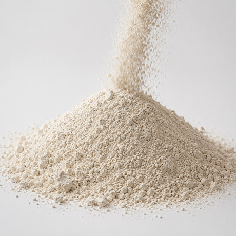 White diatomaceous earth filter aid powder cascading into a loose mound on a clean neutral background