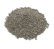 Granular grey absorbent material piled on a white background, resembling clay-based sorbent