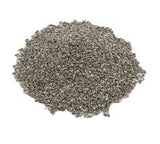 Granular grey absorbent material piled on a white background, resembling clay-based sorbent