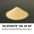 Pile of Siliporite NK 30 AP synthetic zeolite on a black background