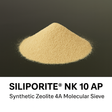 Pile of Siliporite NK 10 AP synthetic zeolite 4A molecular sieve on a black background
