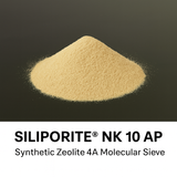 Pile of Siliporite NK 10 AP synthetic zeolite 4A molecular sieve on a black background