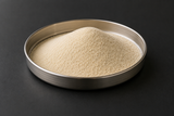 Arkema SILIPORITE NK 10 AP 4A synthetic zeolite molecular sieve powder in a stainless steel sample dish.