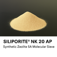 Pile of Siliporite NK 20 AP synthetic zeolite 5A molecular sieve on a black background