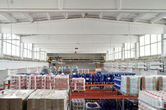 Birds eye view of warehouse storage facility with materials on pallet racks 